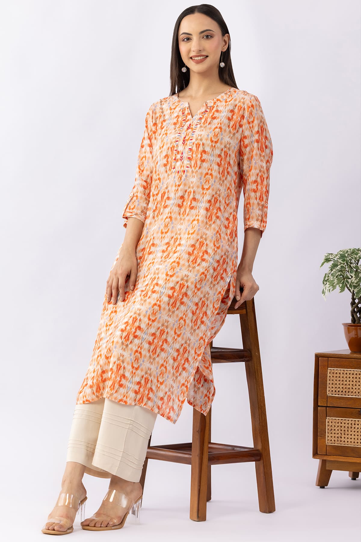 Embroidered orange viscose modal kurti for women with round neck and 3/4 sleeves