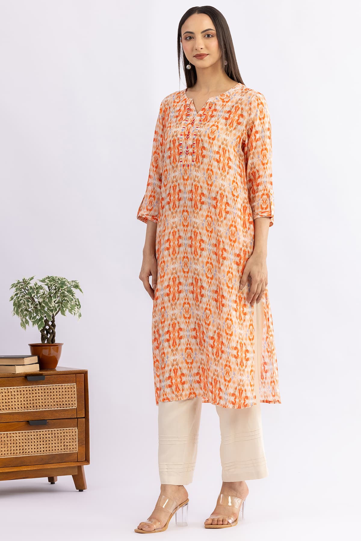 Embroidered orange viscose modal kurti for women with round neck and 3/4 sleeves