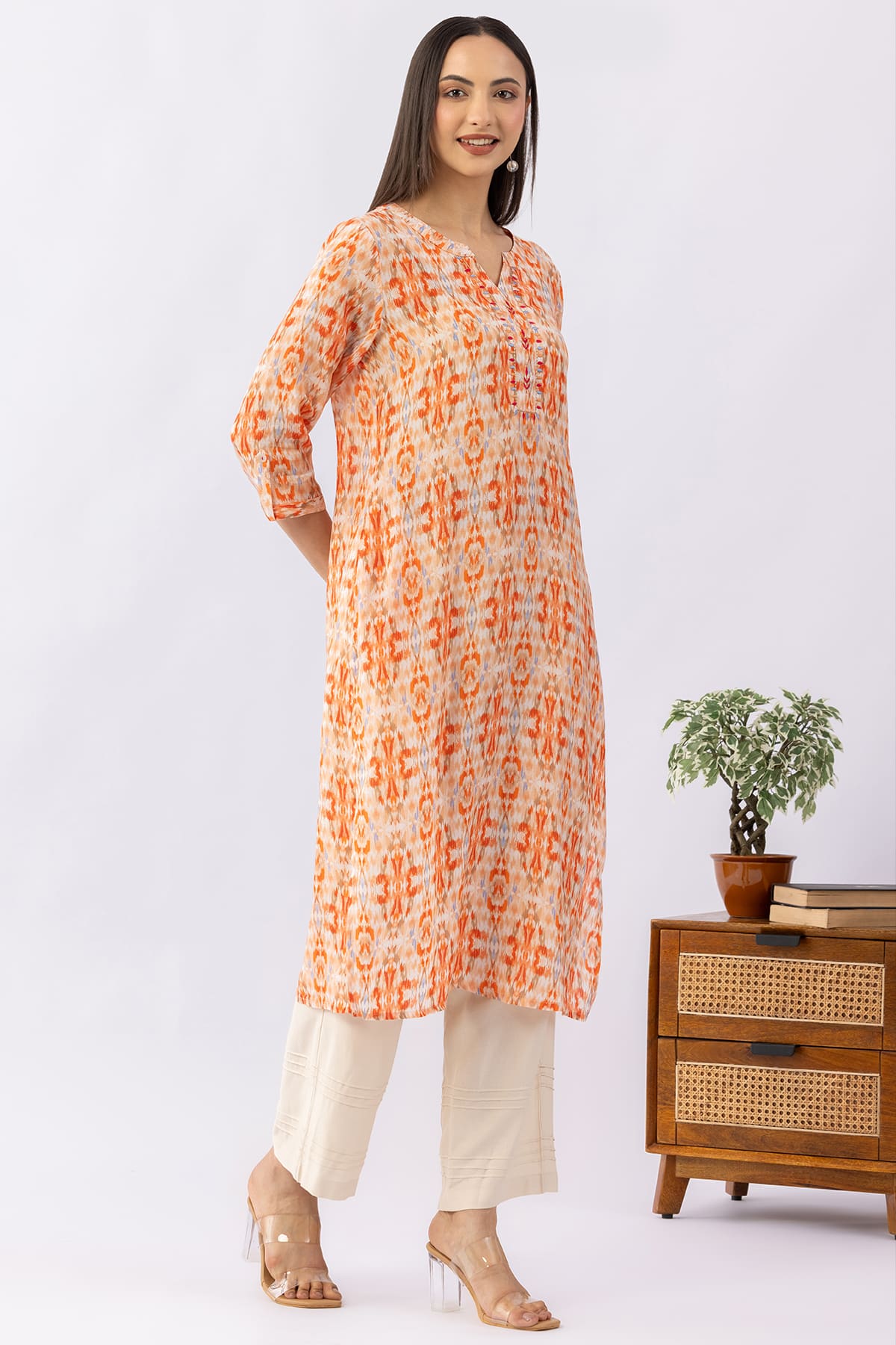 Embroidered orange viscose modal kurti for women with round neck and 3/4 sleeves