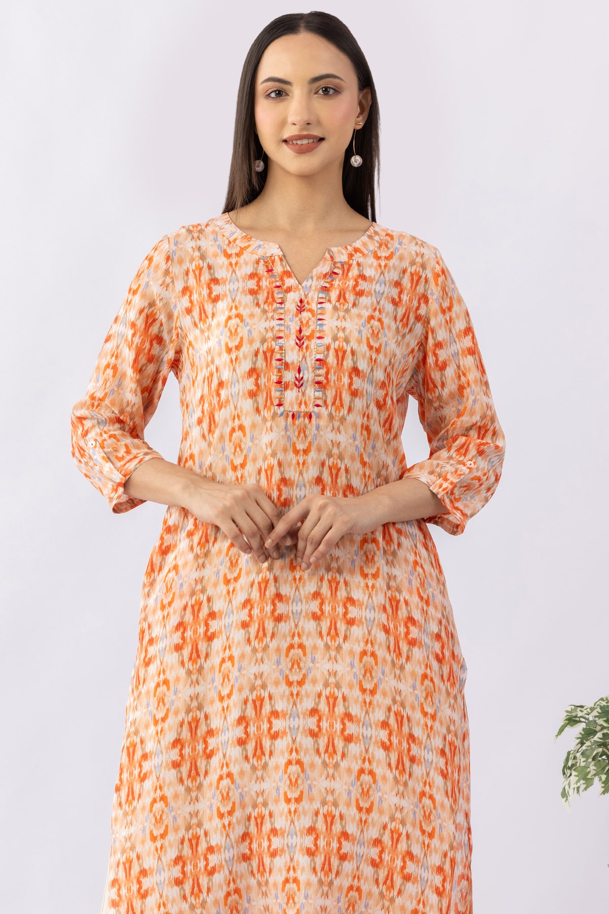 Embroidered orange viscose modal kurti for women with round neck and 3/4 sleeves