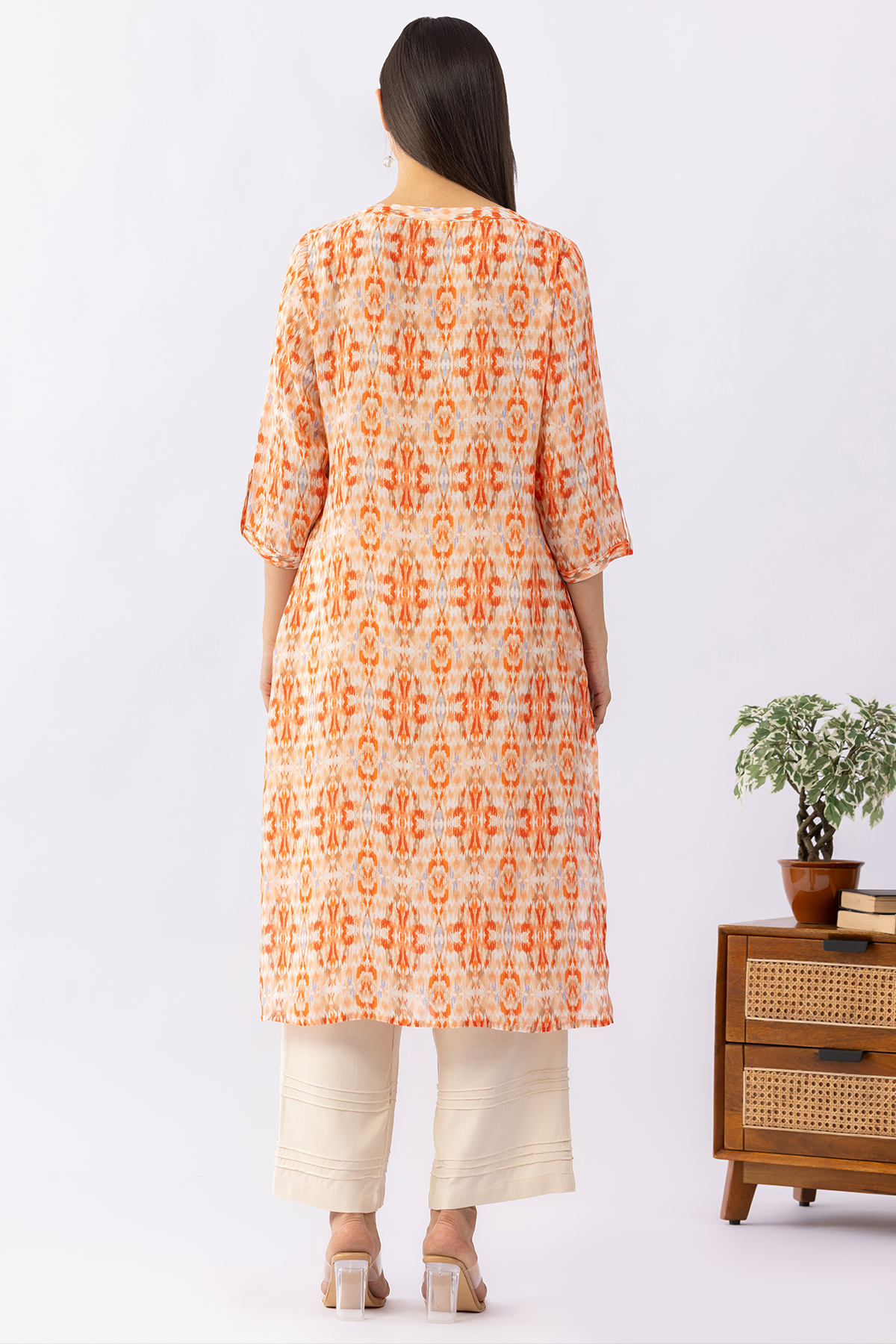 Embroidered orange viscose modal kurti for women with round neck and 3/4 sleeves